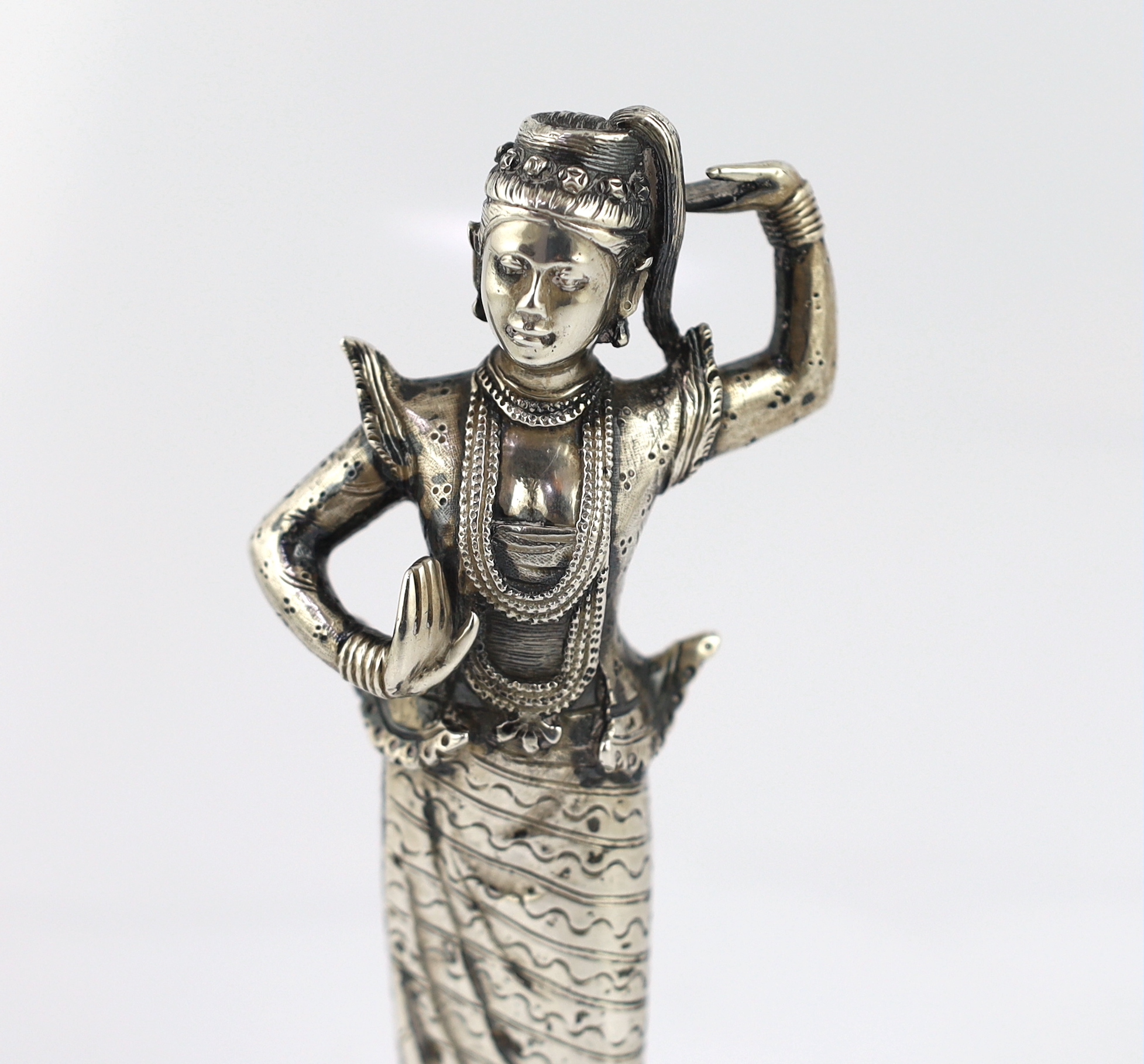 A Burmese cast silver model of a dancer, late 19th century